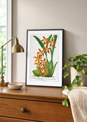 Puzzle en bois d'une planche d'orchidées encadré et posé sur un meuble en bois aux côtés d'une lampe dorée et d'une plante verte.